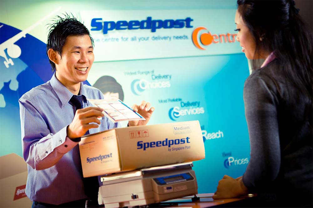 employee of speedpost singapore serving a customer