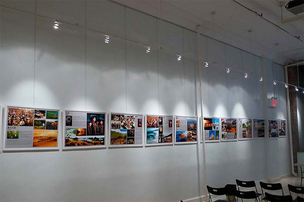 Various pictures on the wall with systematic art hanging system